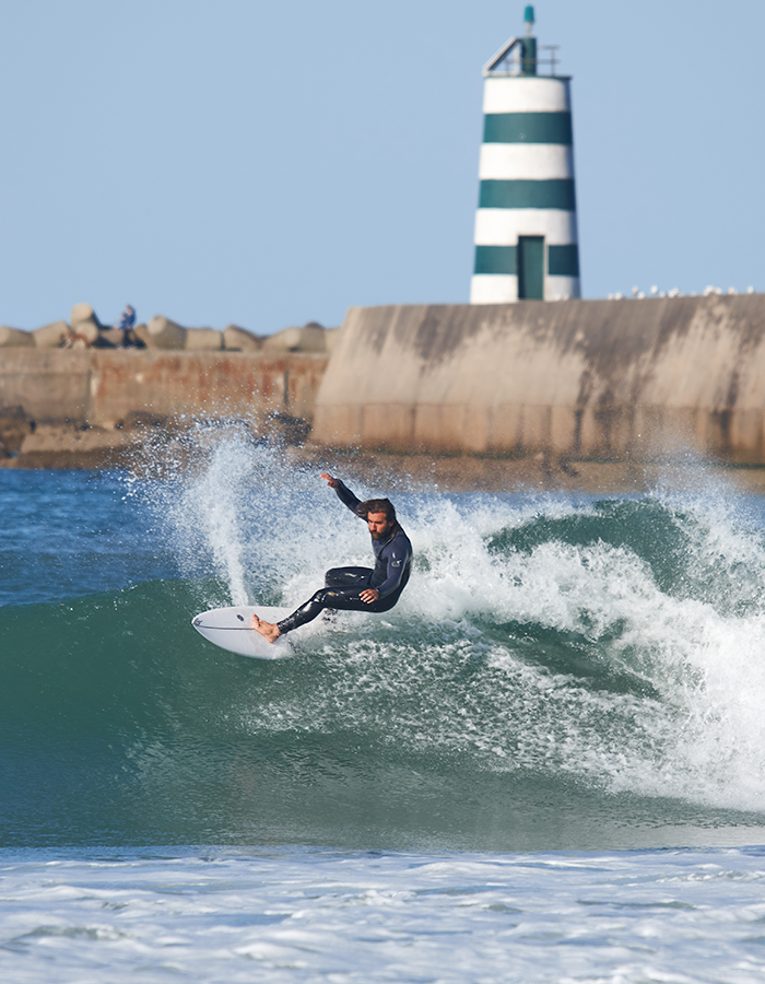 Surf board with front grip pads